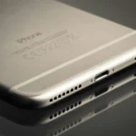 Repairing an iPhone charging port using proper tools on a flat surface